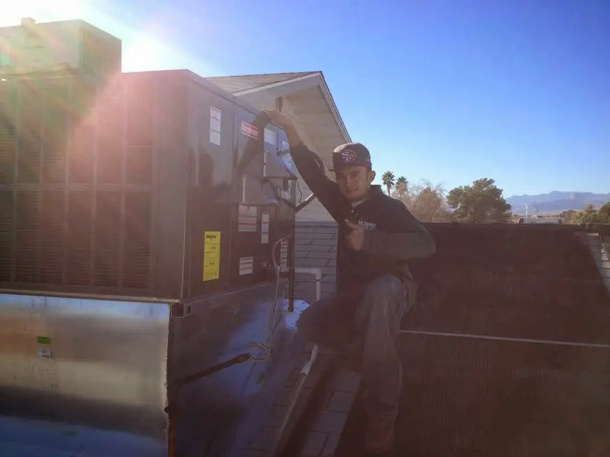 HVAC technician performing HVAC Inspection on a rooftop unit in Hempfield
